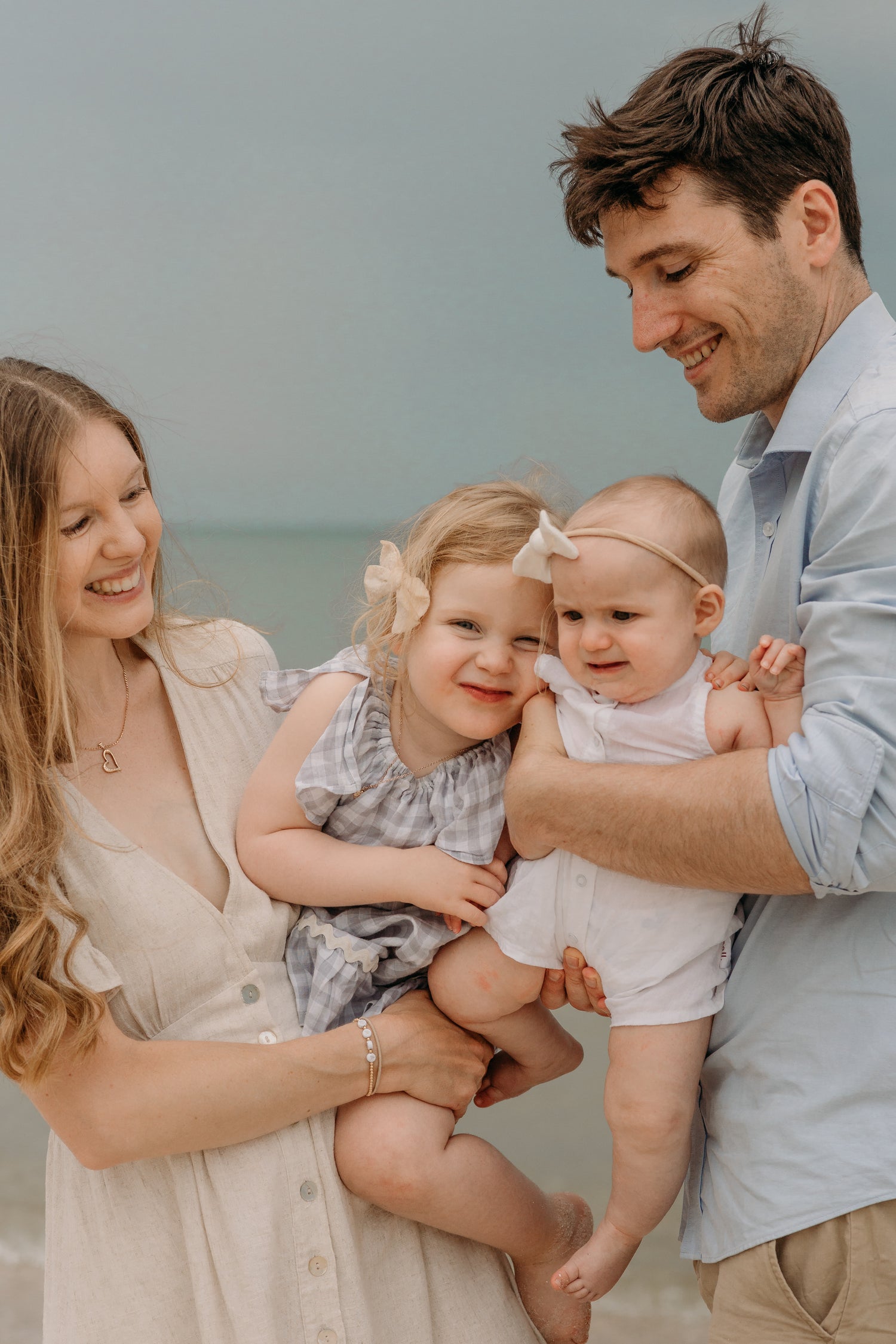 Family photo of mum, dad and babies