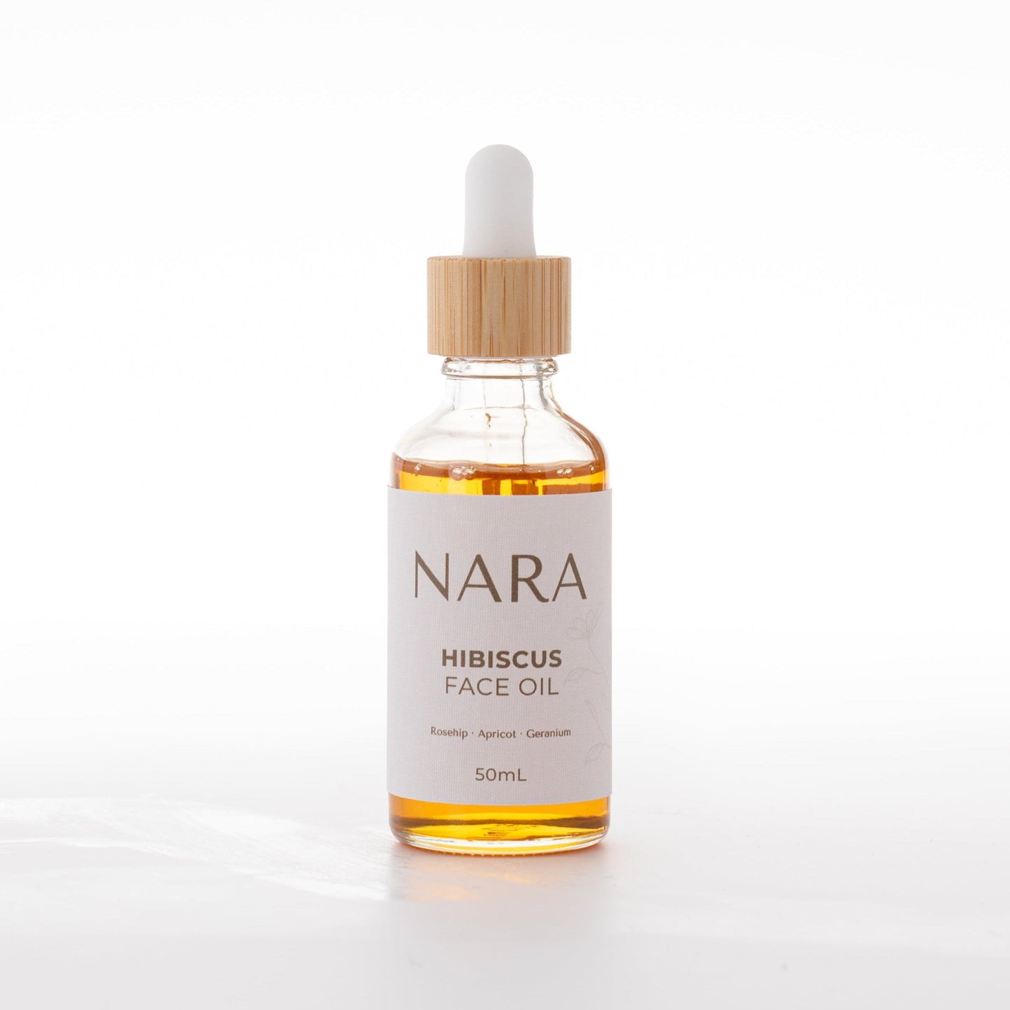 Hibiscus Face Oil with Natural ingredients in eco-friendly glass bottle with rosehip to smoothen and hydrate